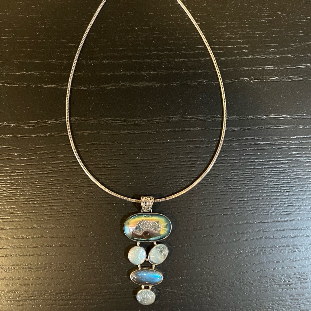 Silver necklace with various shapes of turquoise stones